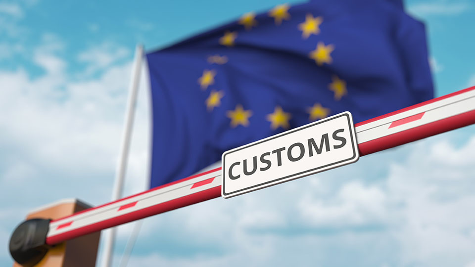 Barrier gate with CUSTOMS sign being closed with flag of the EU as a background. European Border closure or protective tariffs. 3D rendering
